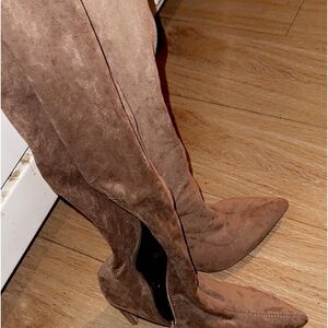 Thigh high boots with zippers